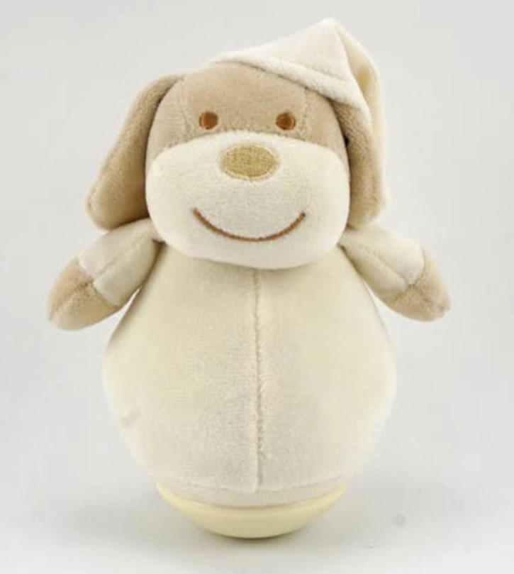 Peluche chien beige qui se balance